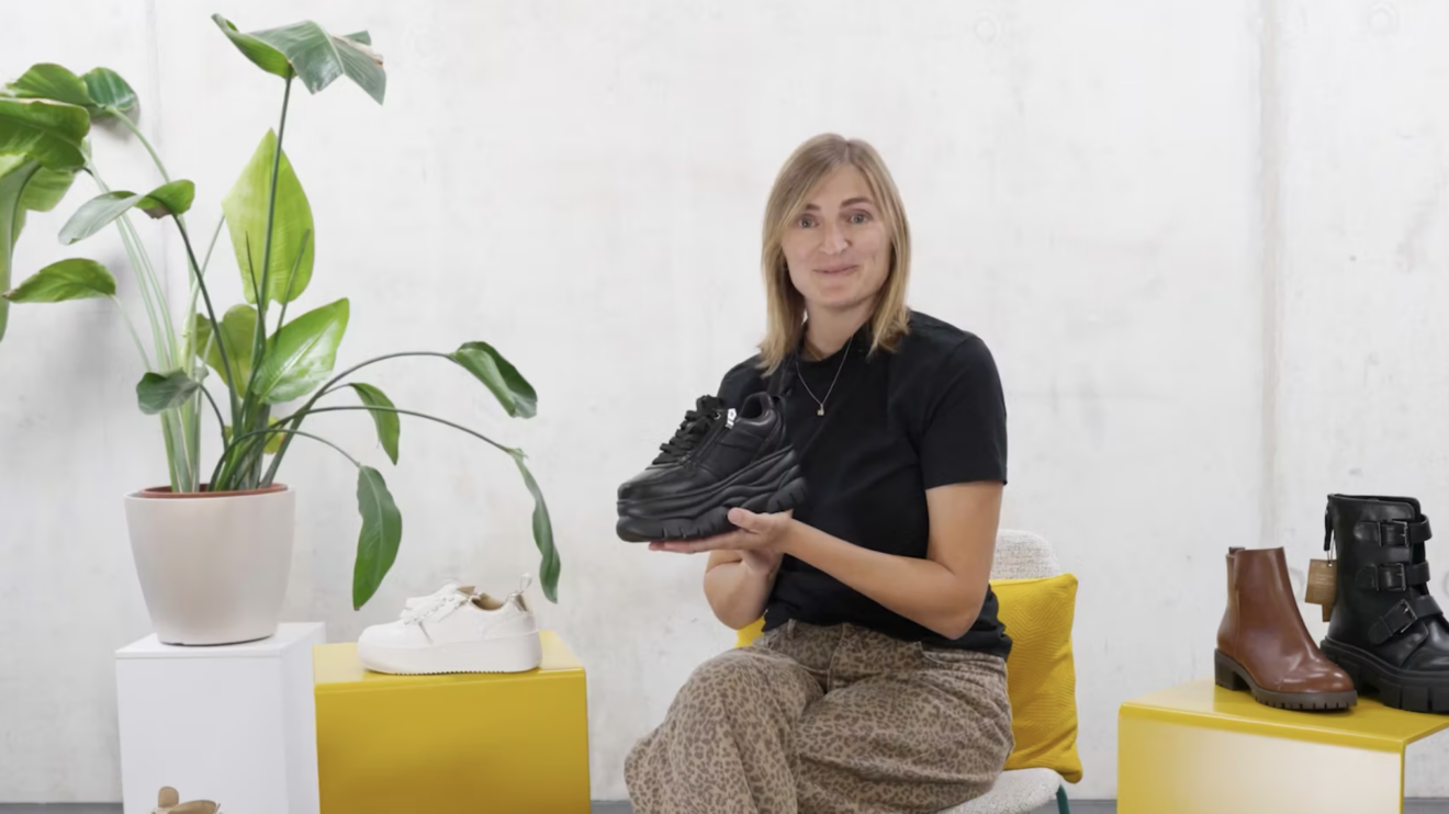 Blonde woman showing adaptive footwear